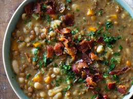 lentils cooking in broth with bacon